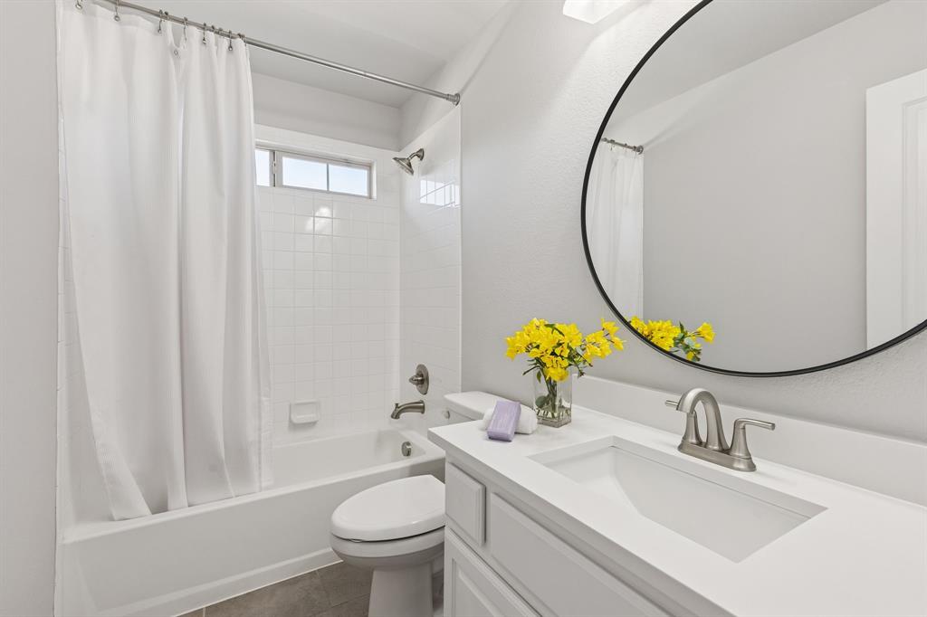 2816 Mona Vale Road Trophy Club, TX 76262 - Photo 25 of 40 a bathroom with a sink vanity mirror and toilet