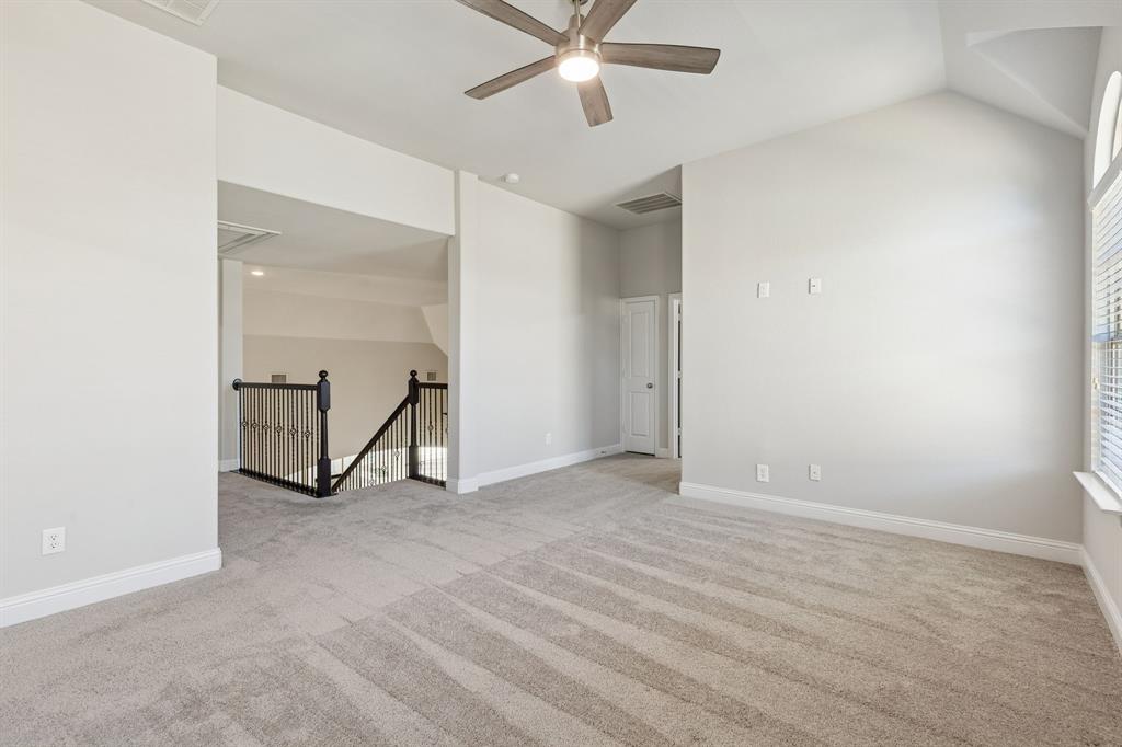 2816 Mona Vale Road Trophy Club, TX 76262 - Photo 27 of 40 an empty room with closet and a ceiling fan