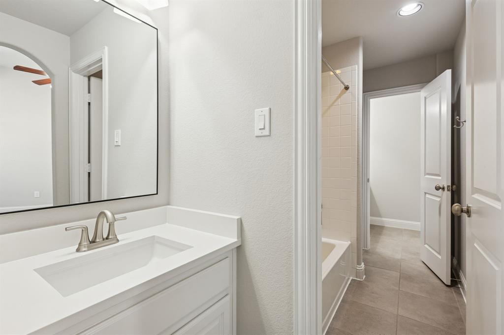 2816 Mona Vale Road Trophy Club, TX 76262 - Photo 28 of 40 a bathroom with a sink and a mirror