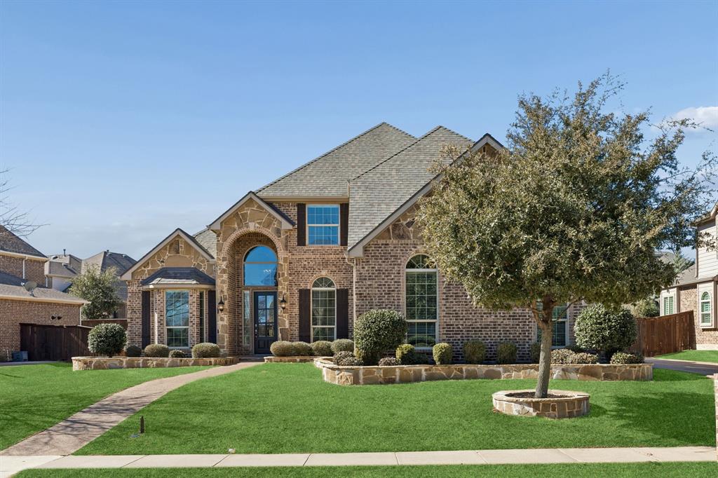 2816 Mona Vale Road Trophy Club, TX 76262 - Photo 37 of 40 a front view of a house with garden and trees