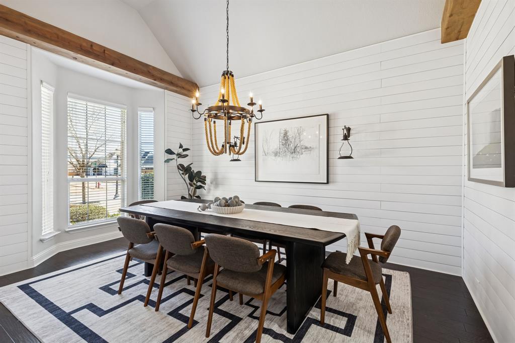 2816 Mona Vale Road Trophy Club, TX 76262 - Photo 7 of 40 a view of a dining room with furniture wooden floor and chandelier