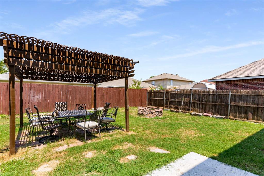 4529 Martingale View Lane Fort Worth, TX 76244 - Photo 28 of 38 a view of a backyard with sitting area and furniture