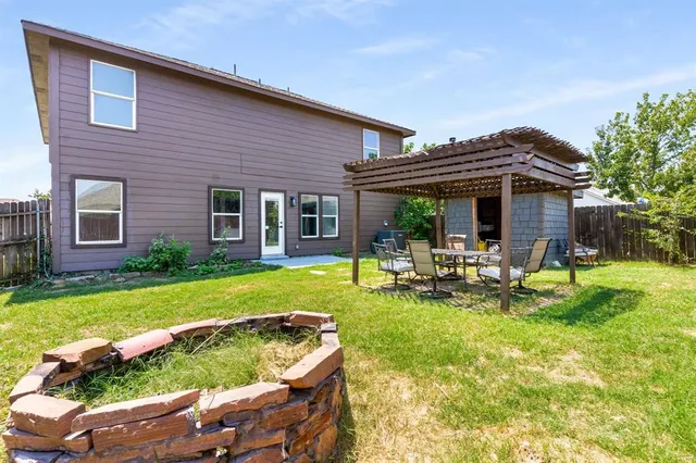 a view of a house with swimming pool and porch