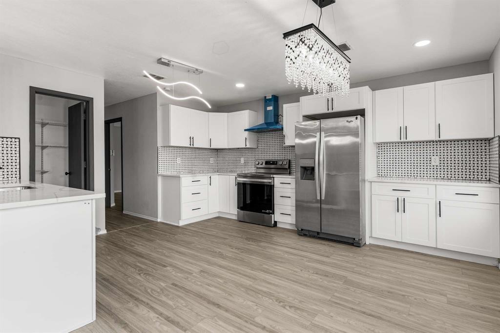 4529 Martingale View Lane Fort Worth, TX 76244 - Photo 3 of 38 a kitchen with stainless steel appliances a refrigerator sink and cabinets