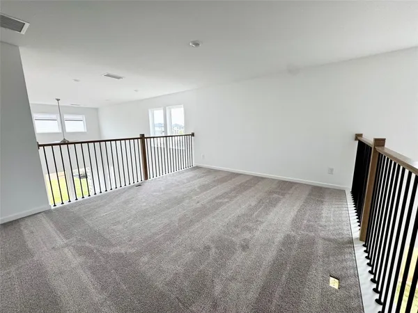 a view of stairs and wooden floor
