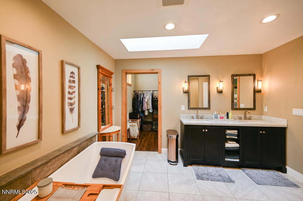 1147 Autumn Hills Road Gardnerville, NV 89460 - Photo 35 of 53 a spacious bathroom with a tub and sink