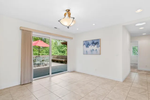 a kitchen with stainless steel appliances granite countertop a sink a stove and a wooden floors