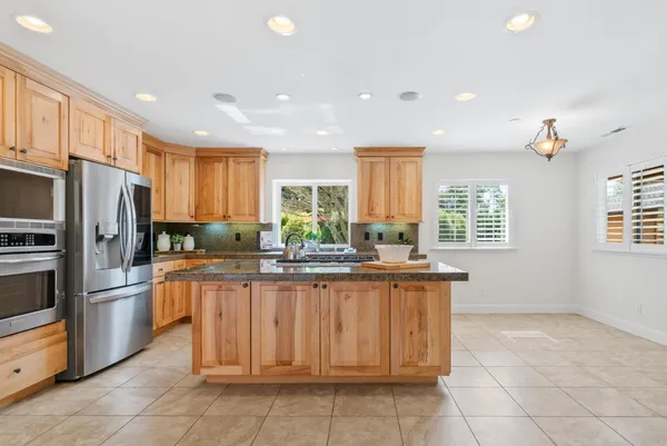 a bedroom with a bed and a potted plant