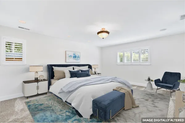 a kitchen with stainless steel appliances granite countertop a sink a stove and a wooden floors