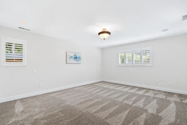 a kitchen with stainless steel appliances granite countertop a sink a stove and a wooden floors