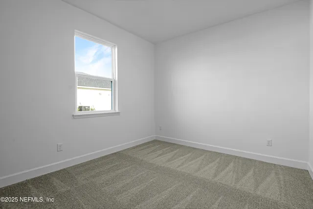 a large kitchen with stainless steel appliances kitchen island granite countertop a sink and a granite counter tops