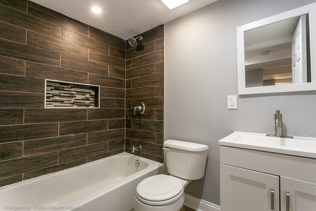 447 West 81st Street, Unit G Chicago, IL 60620 - Photo 20 of 20 a bathroom with a sink toilet and shower
