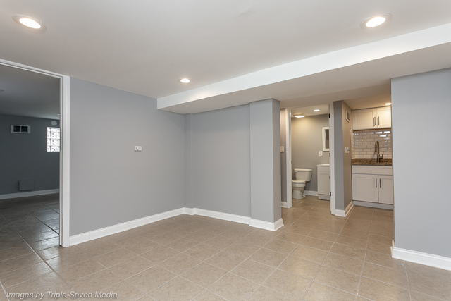 447 West 81st Street, Unit G Chicago, IL 60620 - Photo 6 of 20 wooden floor in a room with a bathroom
