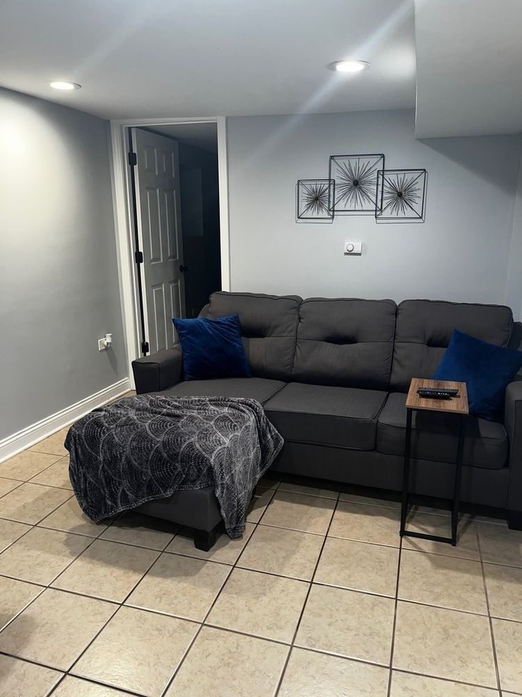 447 West 81st Street, Unit G Chicago, IL 60620 - Photo 8 of 20 a living room with a couch