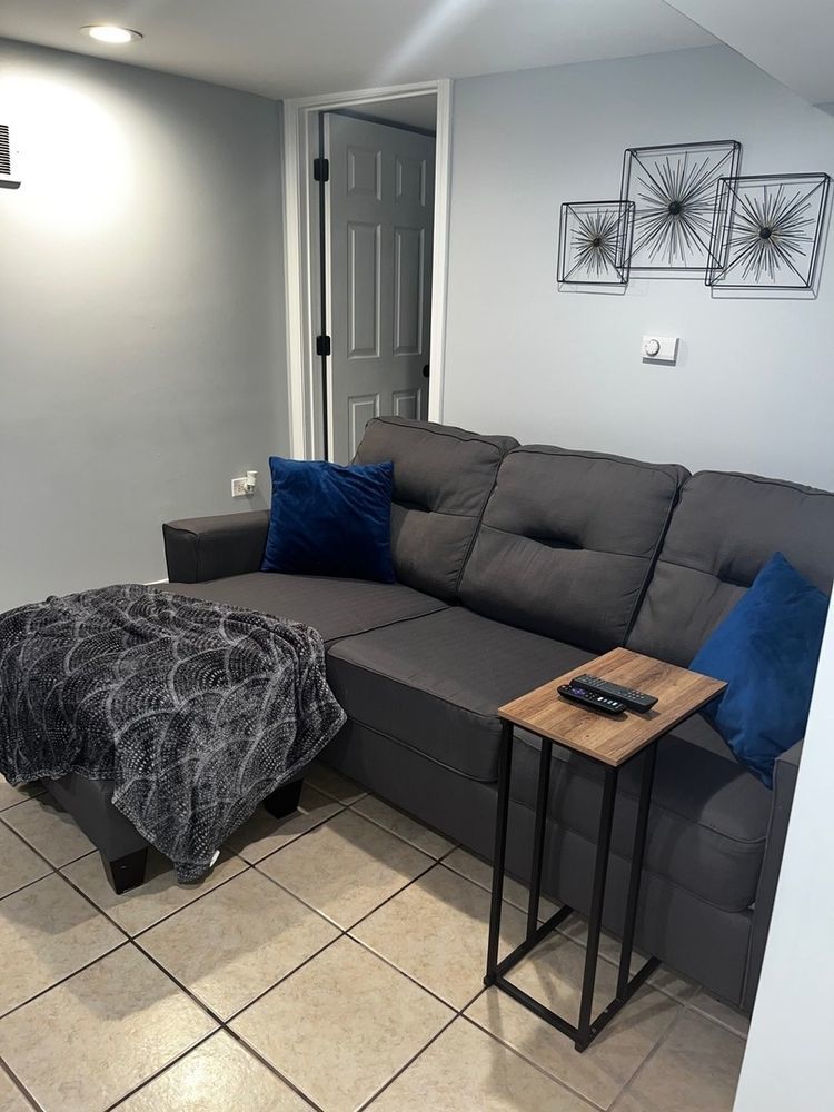447 West 81st Street, Unit G Chicago, IL 60620 - Photo 9 of 20 a living room with furniture and a couch