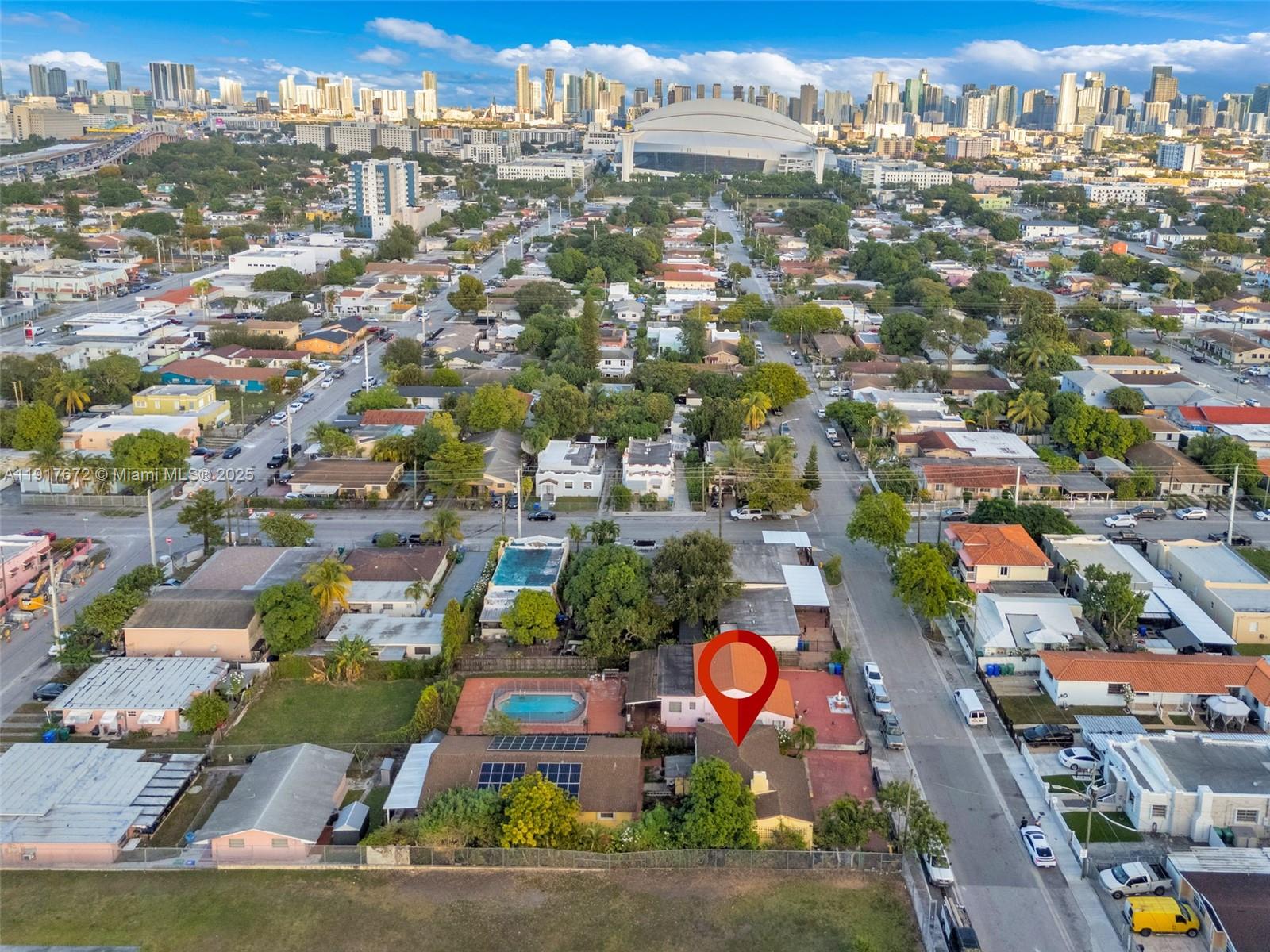 an aerial view of residential houses with outdoor space