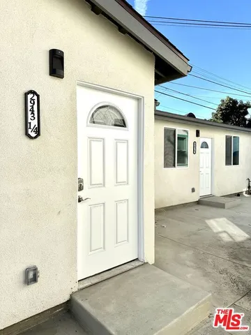 a front view of a house with parking area