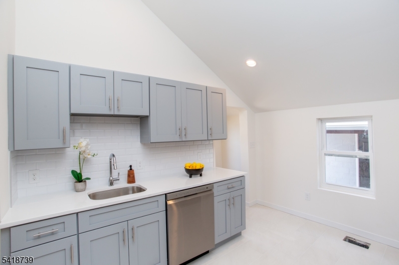 1434 Liberty Street Alpha, NJ 08865 - Photo 11 of 30 a kitchen with a sink and cabinets