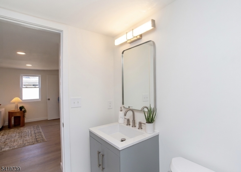 1434 Liberty Street Alpha, NJ 08865 - Photo 12 of 30 a bathroom with a sink and a mirror