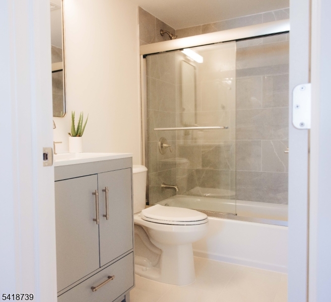 1434 Liberty Street Alpha, NJ 08865 - Photo 13 of 30 a bathroom with a shower a toilet and a sink
