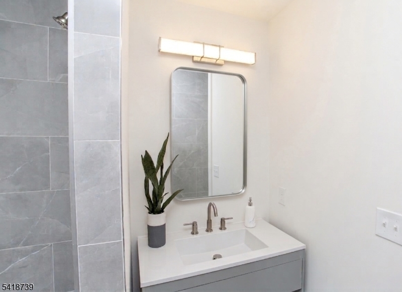 1434 Liberty Street Alpha, NJ 08865 - Photo 17 of 30 a bathroom with a sink and a mirror