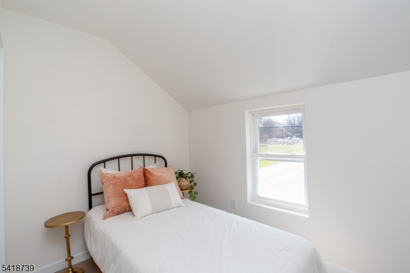 1434 Liberty Street Alpha, NJ 08865 - Photo 19 of 30 a bedroom with a bed and a window
