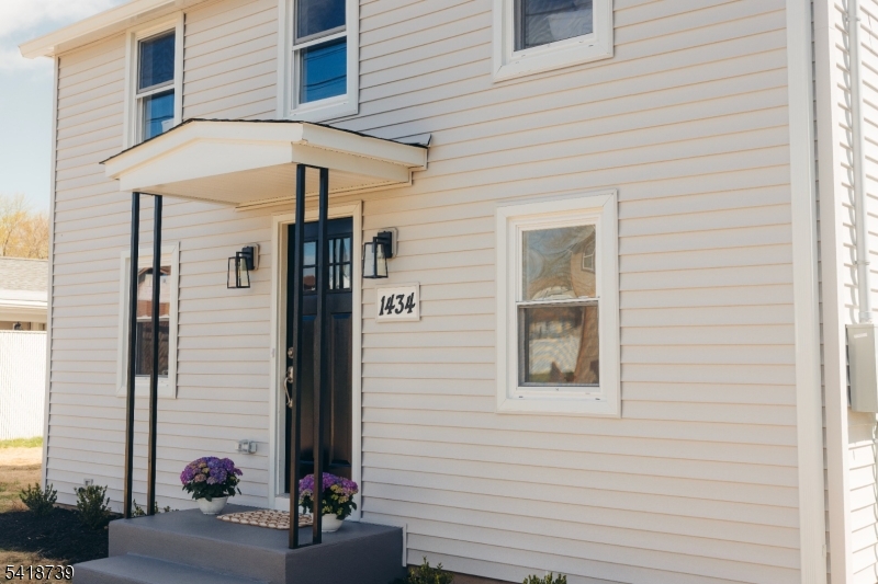 1434 Liberty Street Alpha, NJ 08865 - Photo 3 of 30 a view of a house with a potted plant and a window