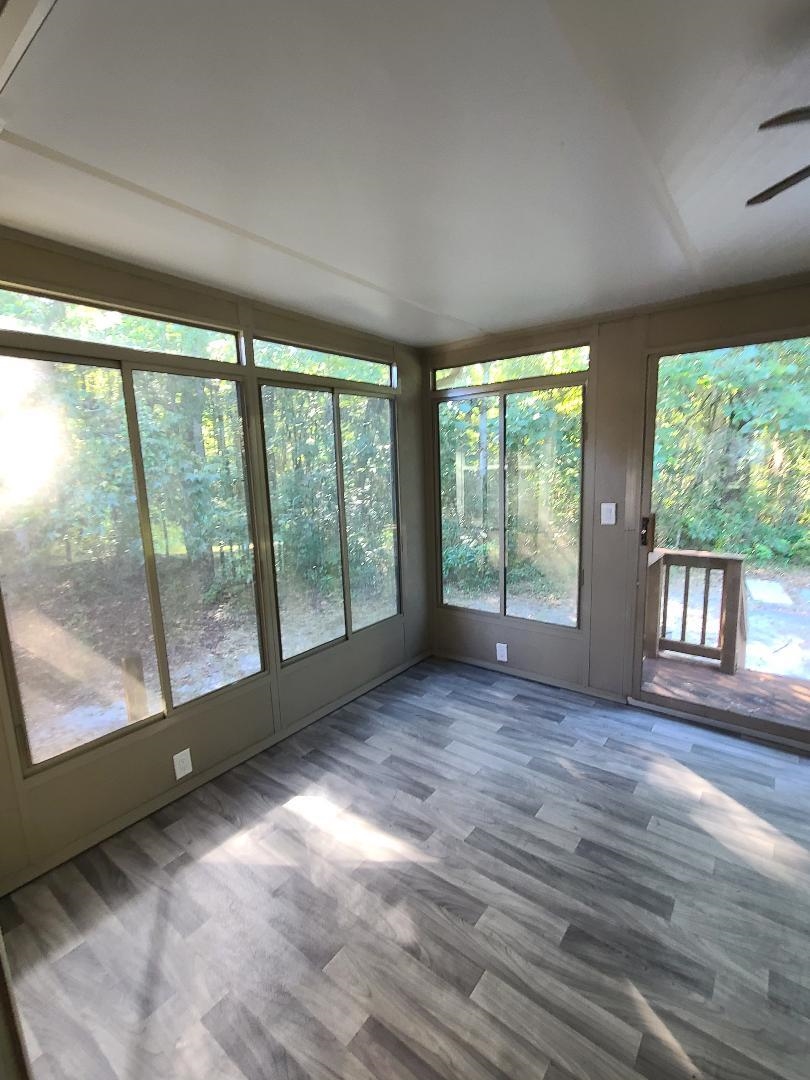 11996 Swooping Willow Road Jacksonville, FL 32223 - Photo 11 of 13 Unfurnished sunroom featuring wood finished floors