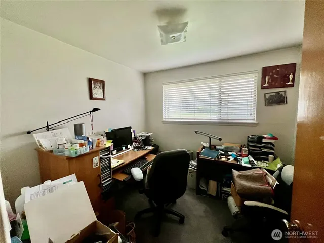 a bed room with furniture and a window