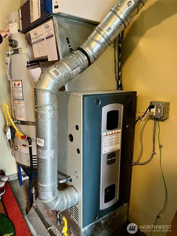 a view of a workspace with a window and couch