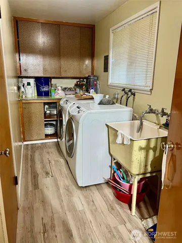 a view of a living room with furniture and a flat screen tv