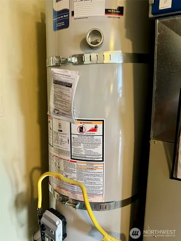 a view of a hallway with furniture and entryway