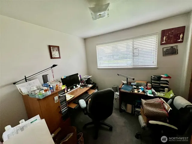 a reading room with furniture toys and a window