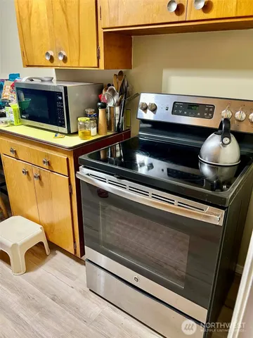 a close view of stove and microwave