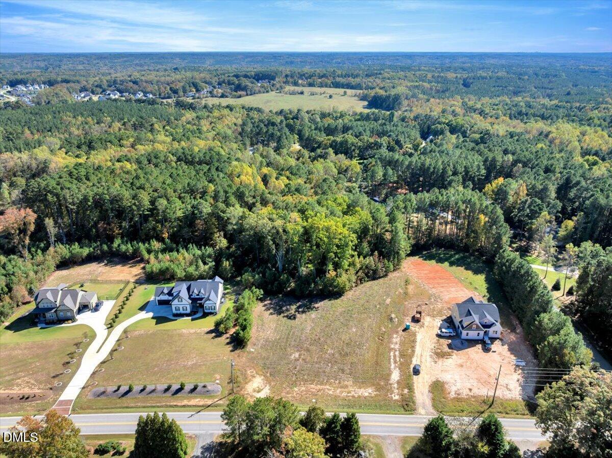 3210 Bruce Garner Road Creedmoor, NC 27522 - Photo 1 of 1 an aerial view of a house with a yard