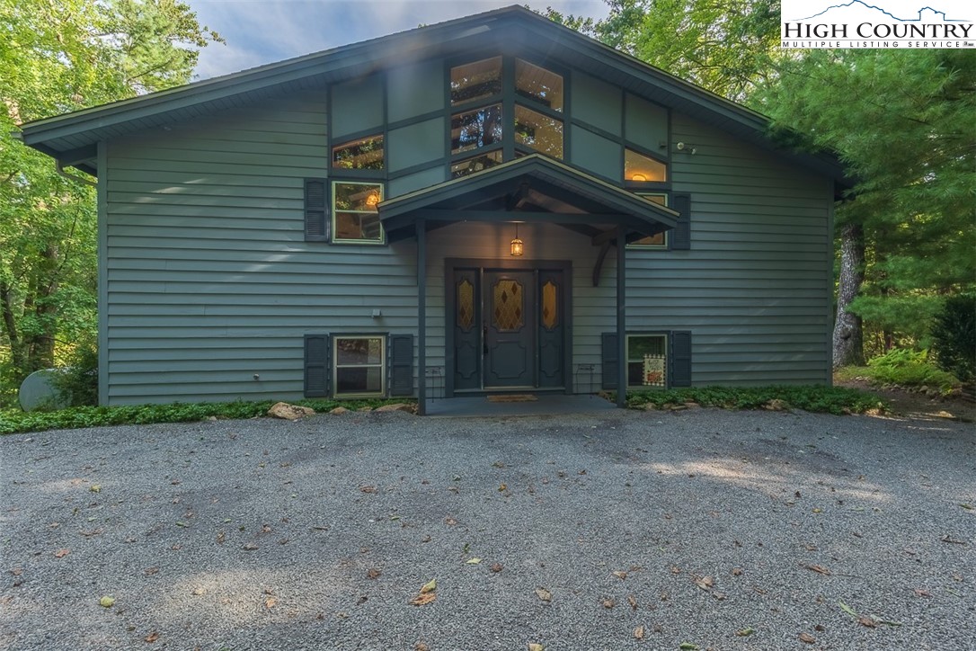 377 Deer Run Road Glade Valley, NC 28627 - Photo 25 of 26 a view of a house with a yard