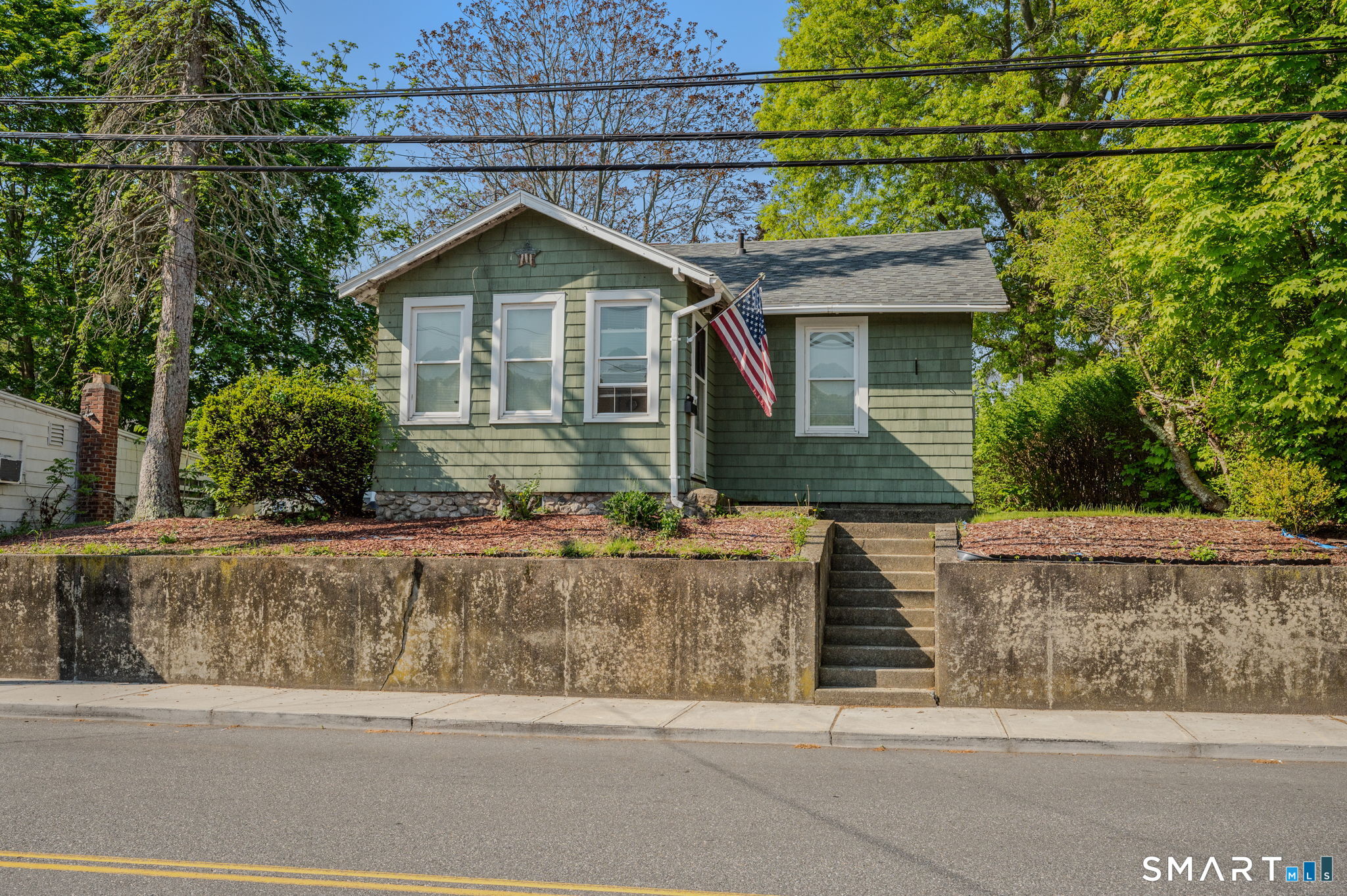 231 Poquonnock Road Groton, CT 06340 - Photo 1 of 30 a front view of a house with garage