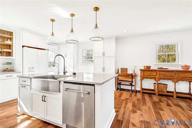 a kitchen with a sink cabinets and window