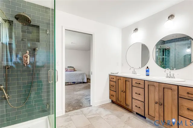 a bathroom with a double vanity sink and a mirror