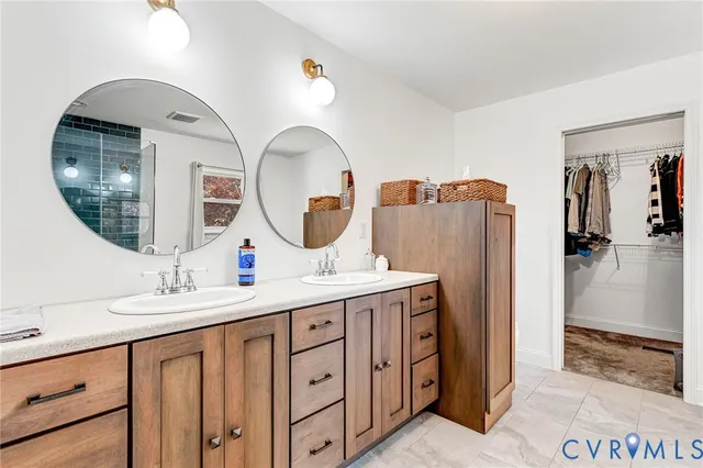 a bathroom with a shower and a sink