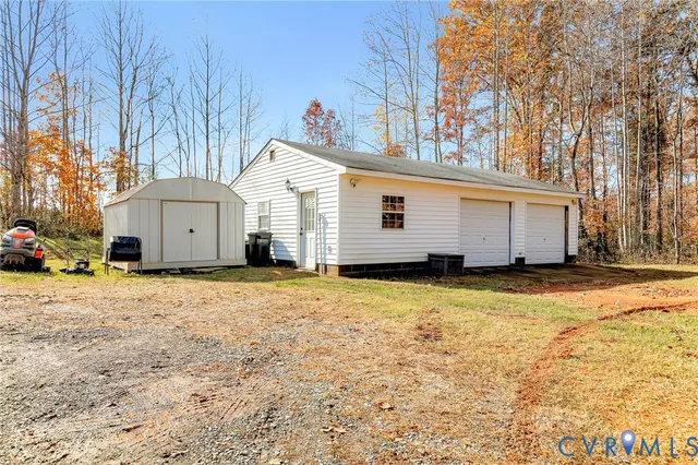 a view of a yard with a tree