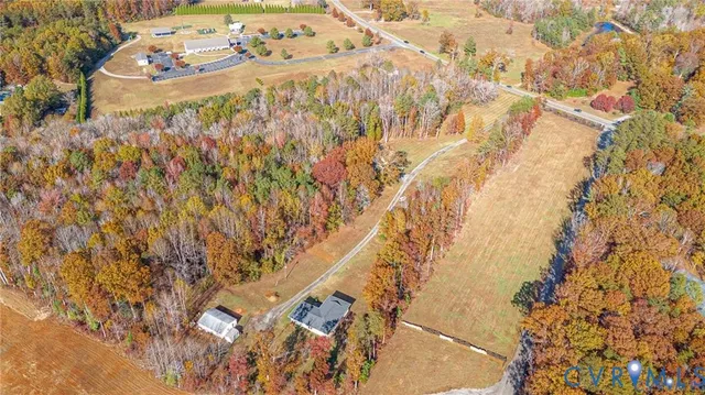 a view of a yard with wooden fence