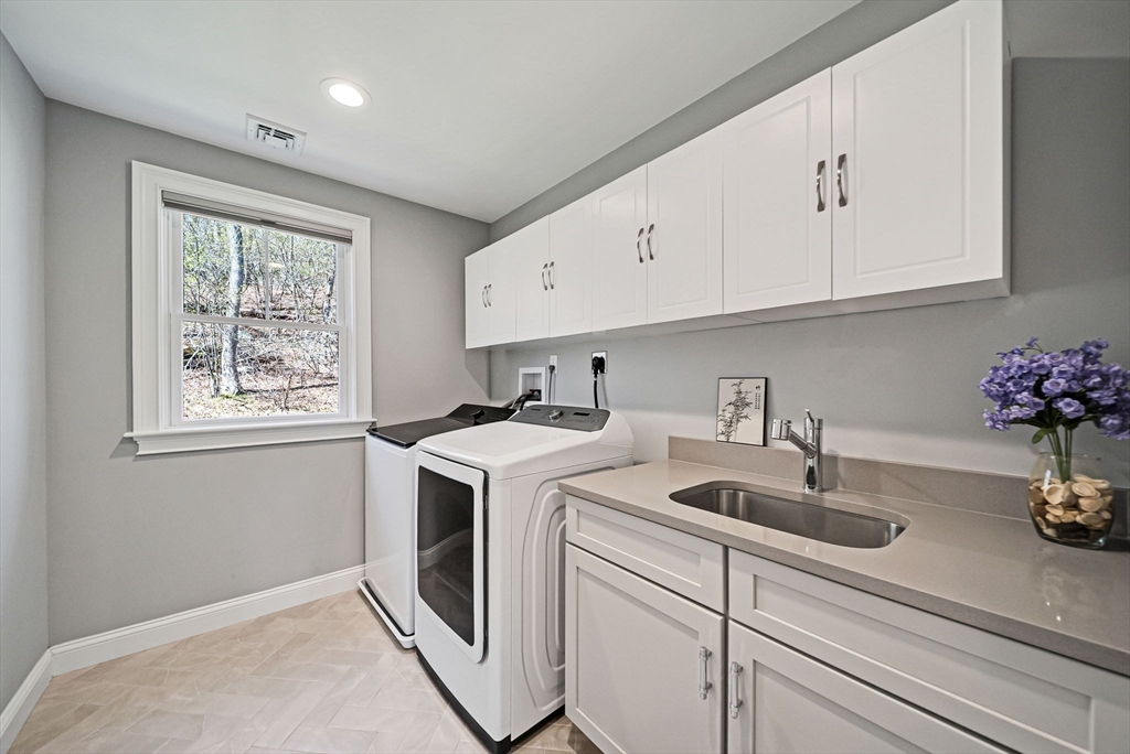 17 Sunrise Terrace Needham, MA 02492 - Photo 26 of 42 a view of cabinets a sink and dishwasher with wooden floor