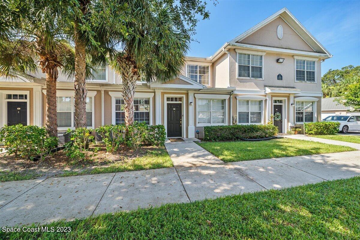 110 Colibri Way, Unit 107 Melbourne, FL 32901 - Photo 1 of 27 a front view of a house with a yard