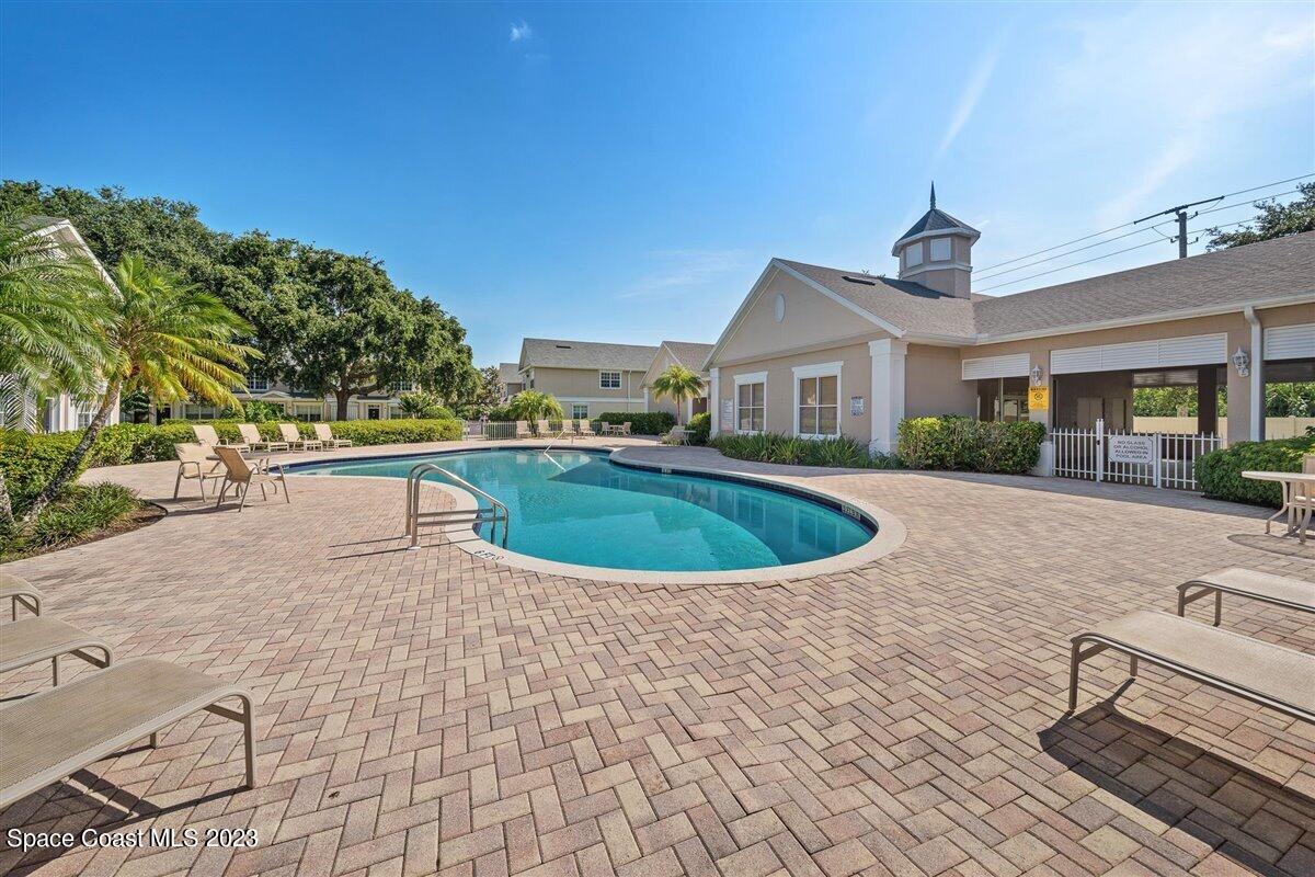 110 Colibri Way, Unit 107 Melbourne, FL 32901 - Photo 23 of 27 a view of a house with a swimming pool