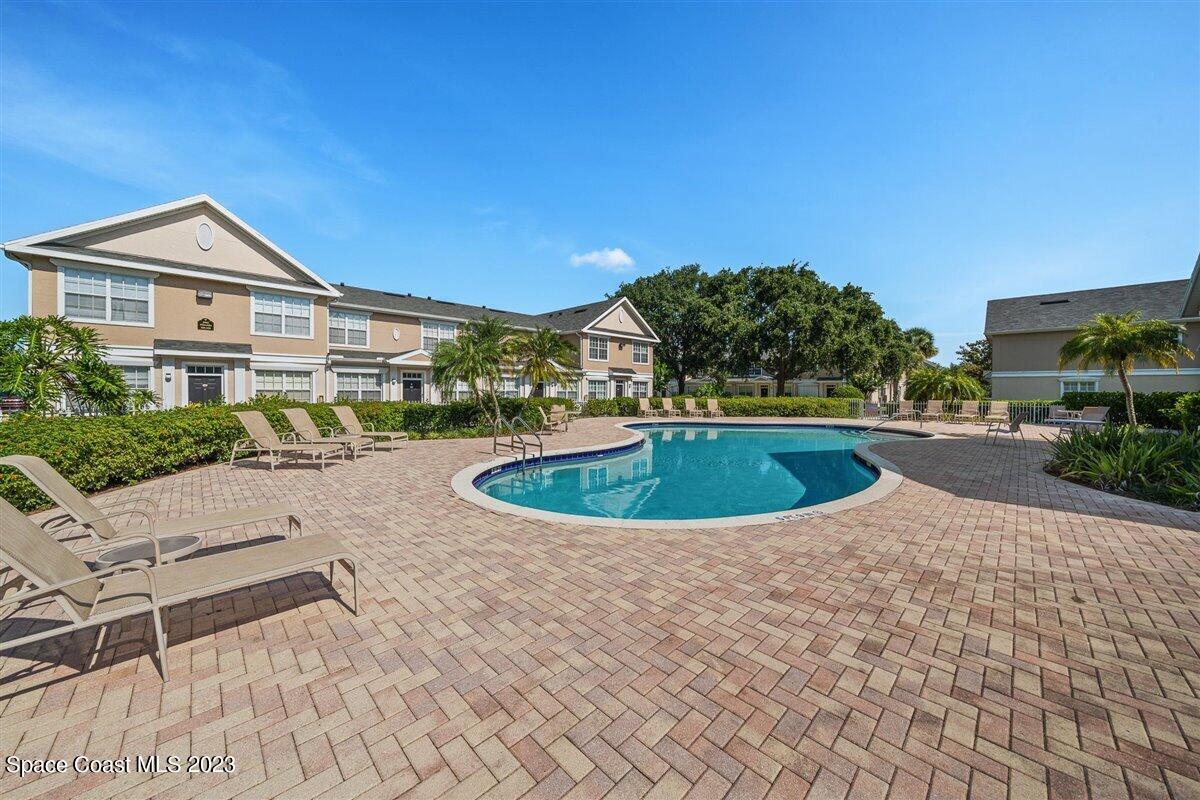 110 Colibri Way, Unit 107 Melbourne, FL 32901 - Photo 24 of 27 a view of a house with a swimming pool