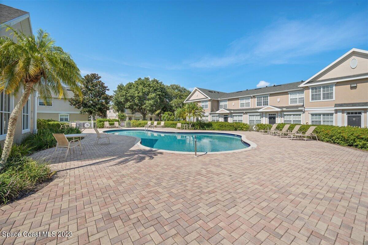 110 Colibri Way, Unit 107 Melbourne, FL 32901 - Photo 25 of 27 a view of outdoor space yard and swimming pool