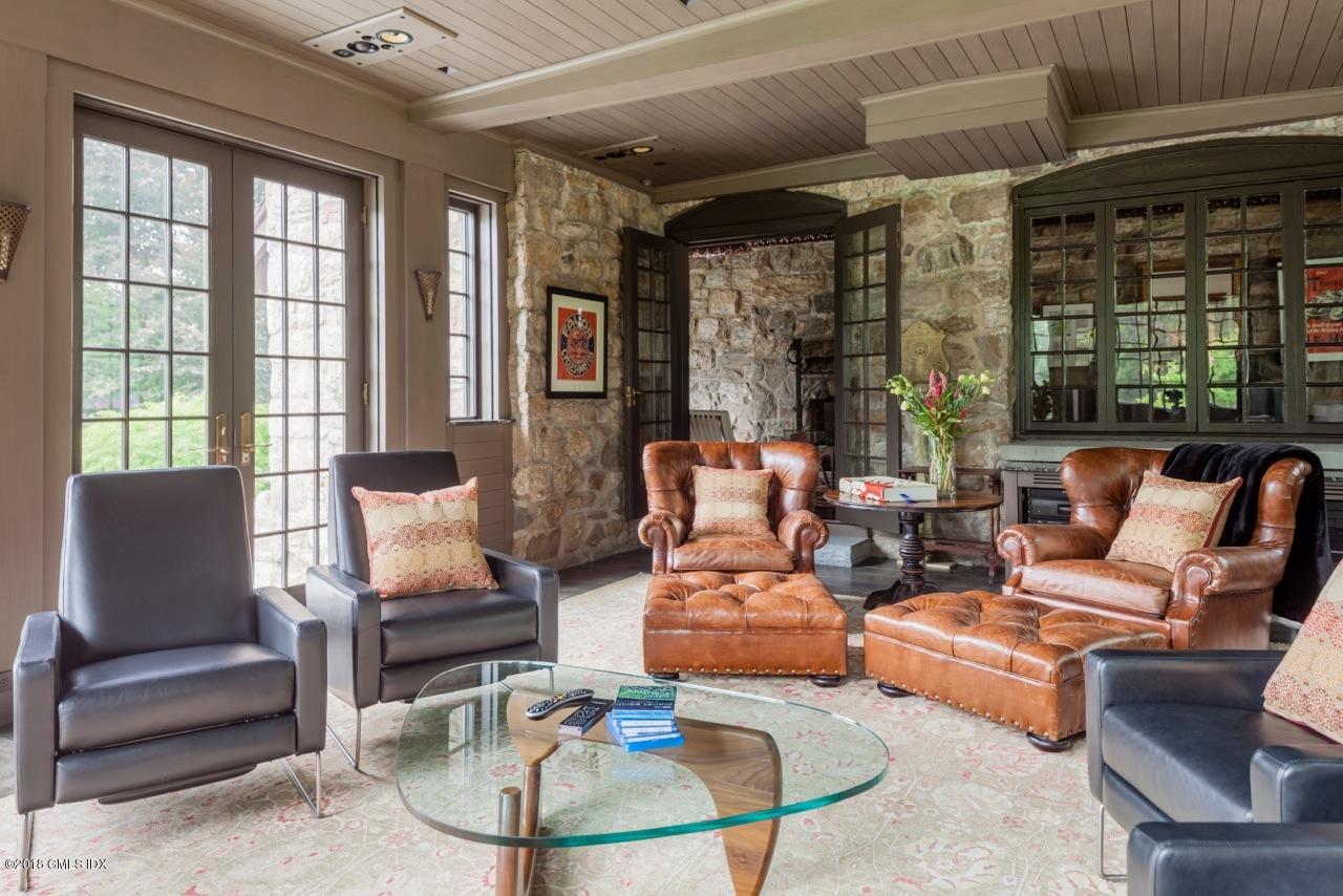 47 Carriglea Drive Riverside, CT 06878 - Photo 28 of 49 a living room with furniture and a potted plant