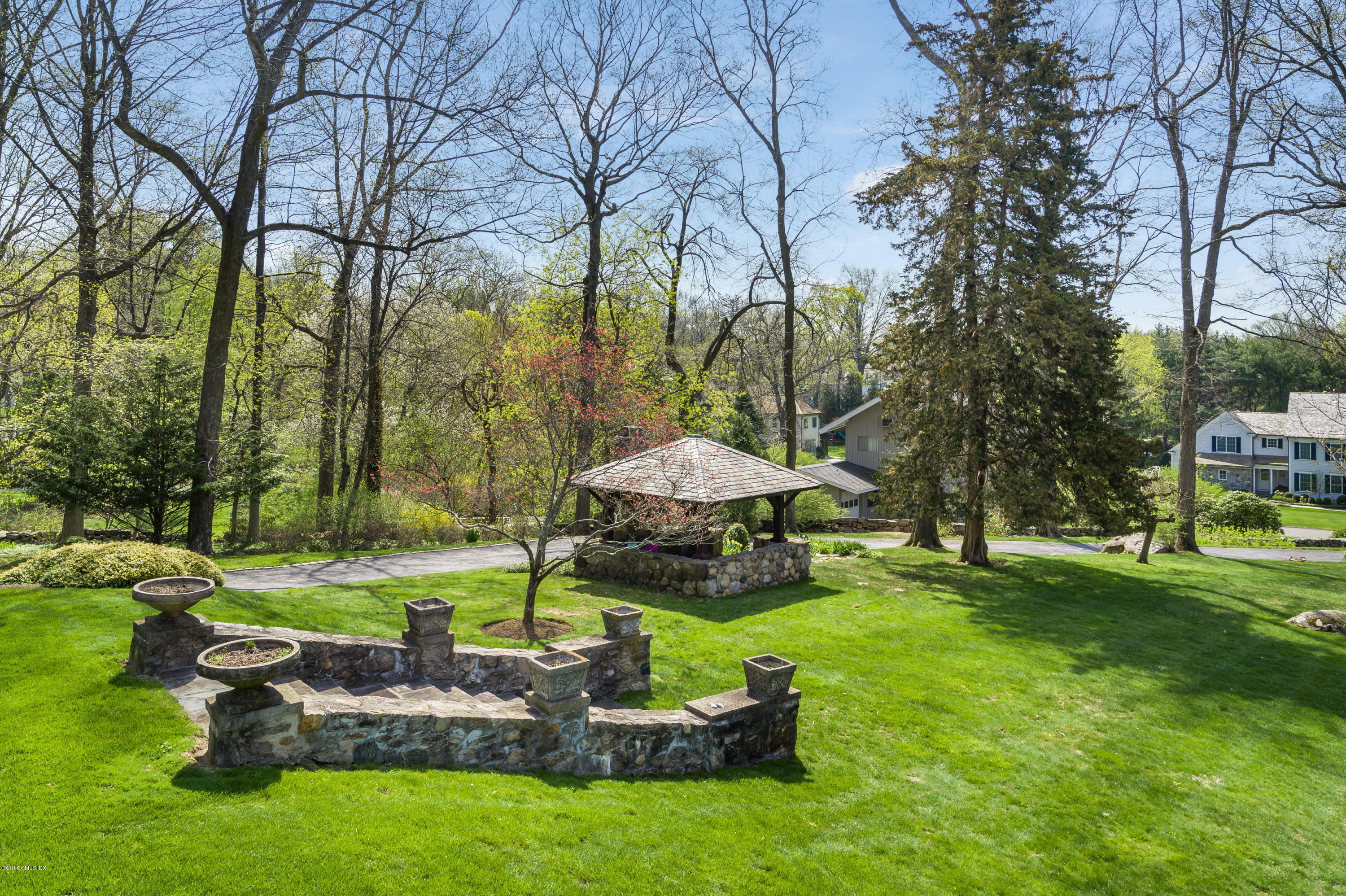 47 Carriglea Drive Riverside, CT 06878 - Photo 48 of 49 a backyard of a house with yard and outdoor seating