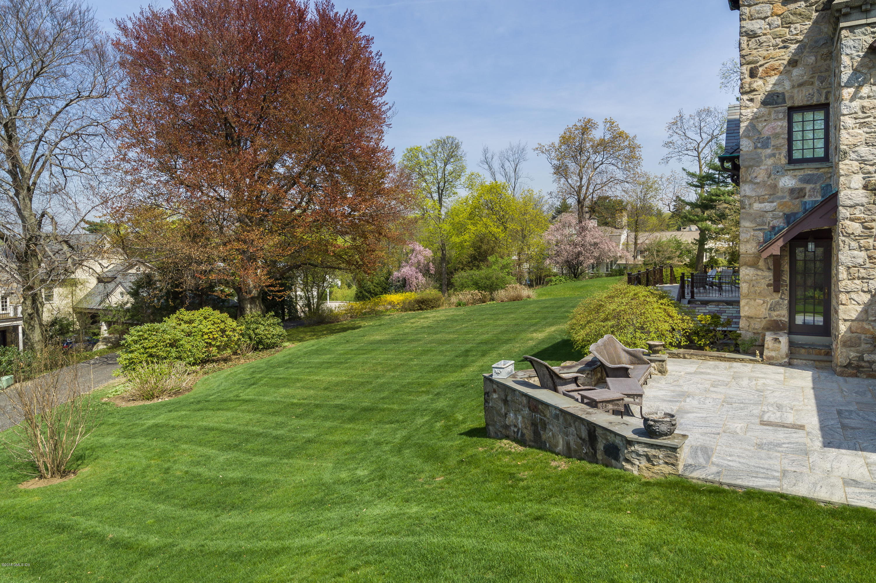 47 Carriglea Drive Riverside, CT 06878 - Photo 6 of 49 a view of a backyard with plants and outdoor seating